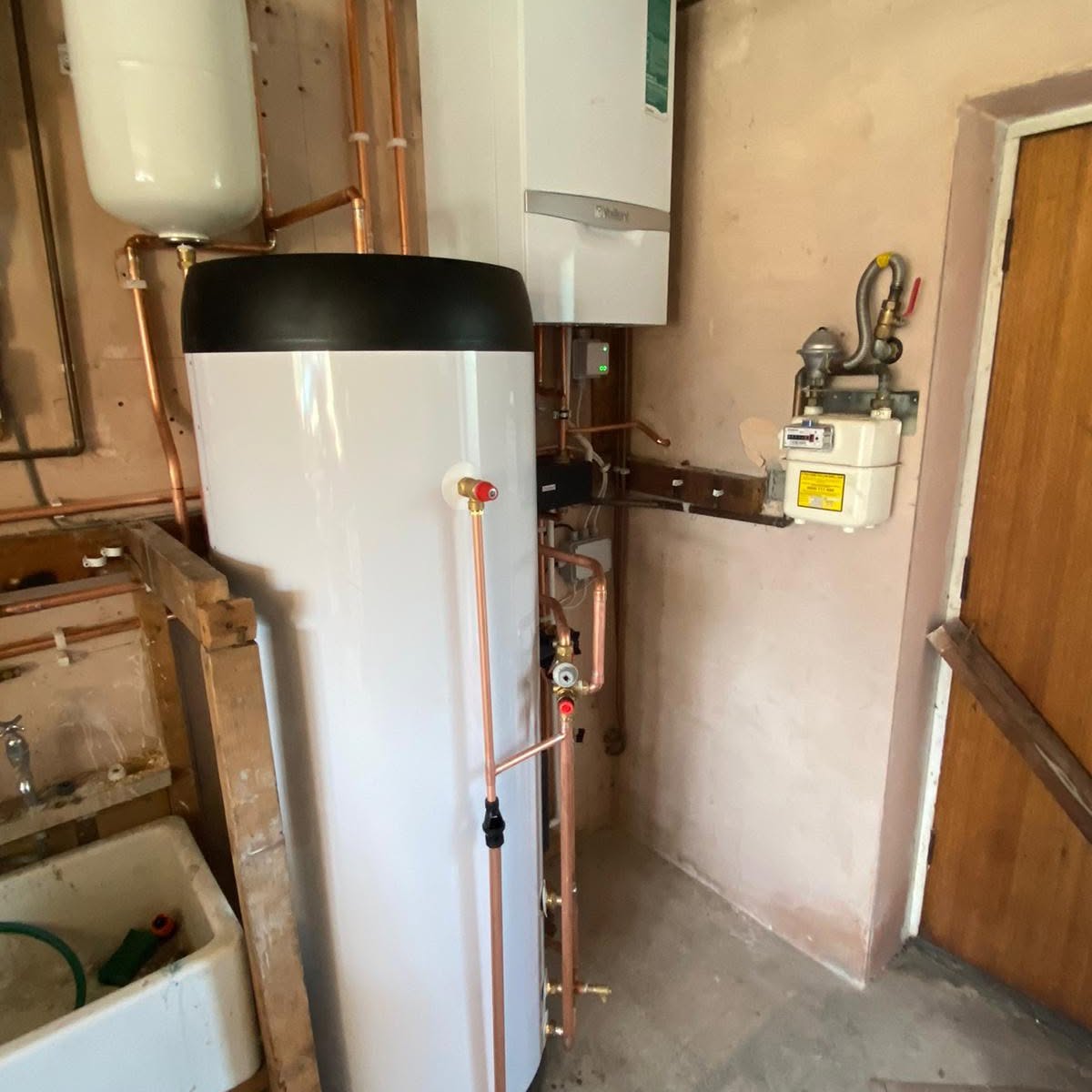 System boiler and hot water cylinder install with copper pipework, Rochdale